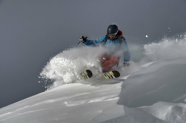 Extreme skier with sticks in motion