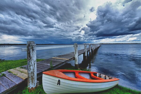 Boat on the shore before the storm