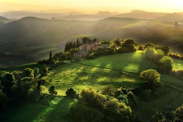 Old castle in the fields at sunset