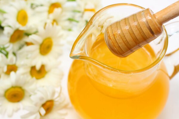 Chamomile t jug with flower honey