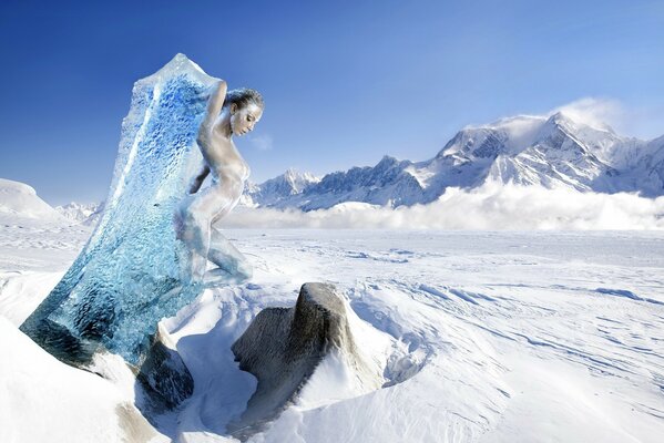 A girl in the snow in the cold in a block of ice