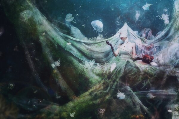 Underwater fantasy world with a live girl and jellyfish