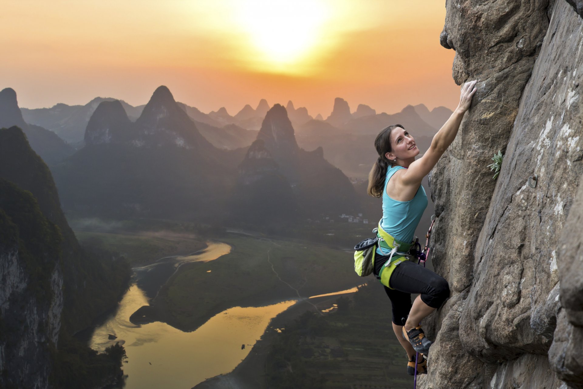 woman climbing mountain