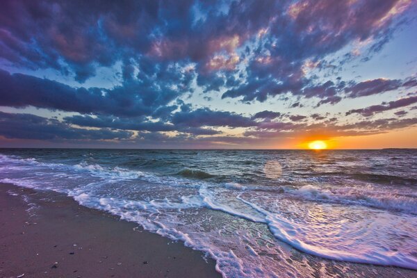 The seashore on the background of sunset