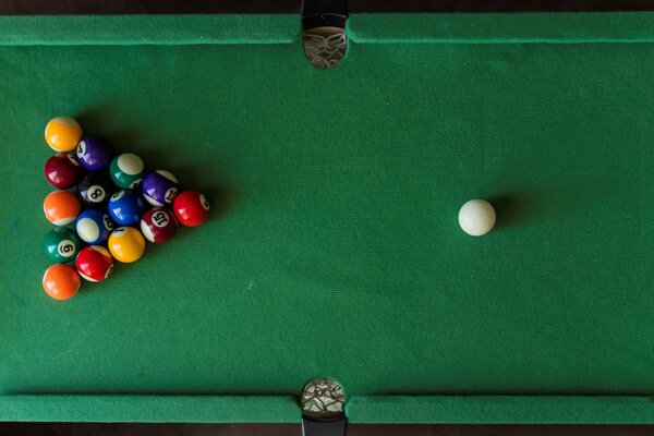 Billiard table with balls folded into a triangle