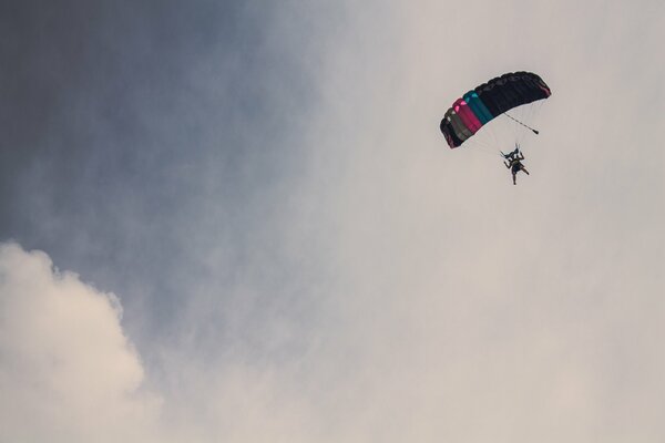 Bottom view of a parachutist in the clouds