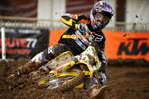 Motorsport track motorcyclist in the mud