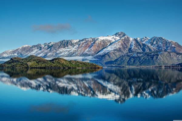 Large mountains with a mirror lake