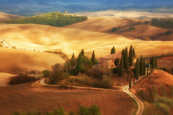 A house with fields and meadows around it