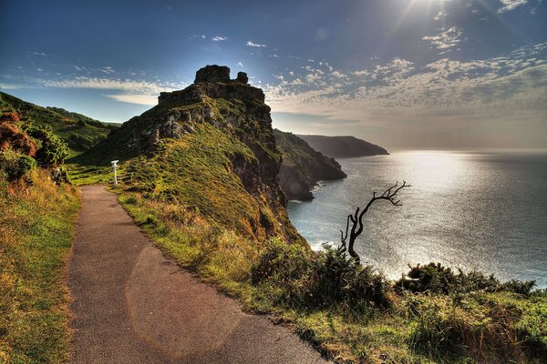 A path along the edge of the shore with rocks