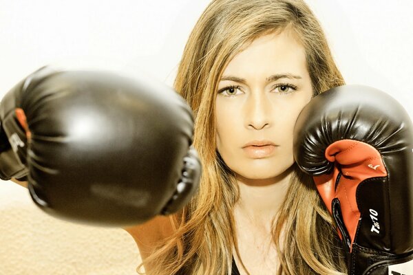 Blonde in boxing gloves hits right