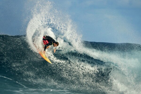 Surfer on the wave created a lot of splashes