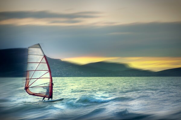 A man on a sail in the sea. Sailing