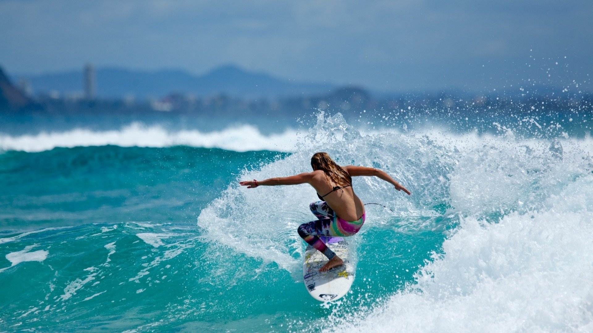 girl surfing sea wave photo