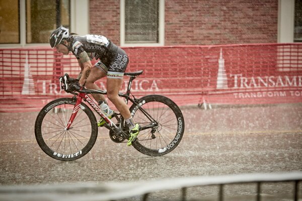 Race in the rain. Cycling pros