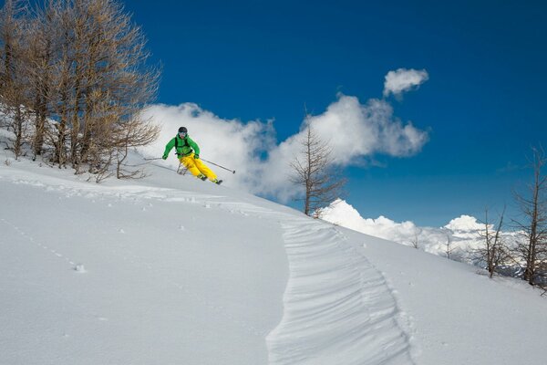 Descent from the mountain of an athlete on skis