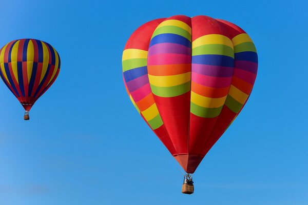 Colorful balloons soar in the sky