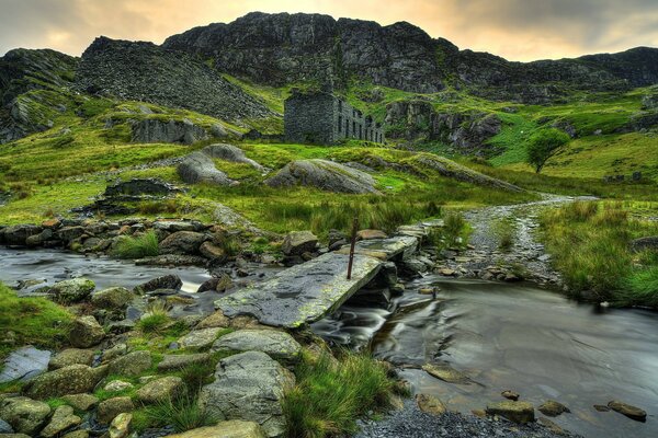 A ruined bridge among the mountains in the UK