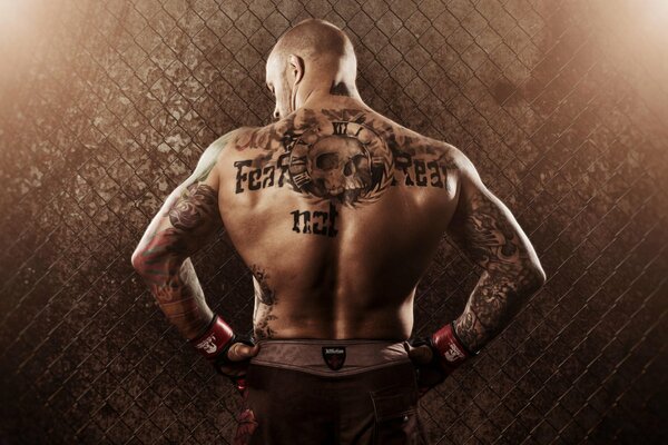 Tattoo on the back of a mixed martial arts wrestler