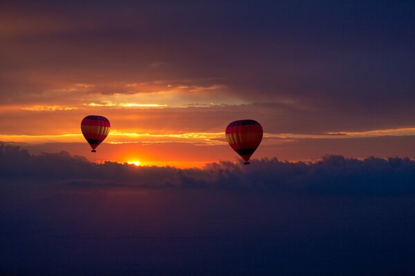 Balloons in the sunset sky photo