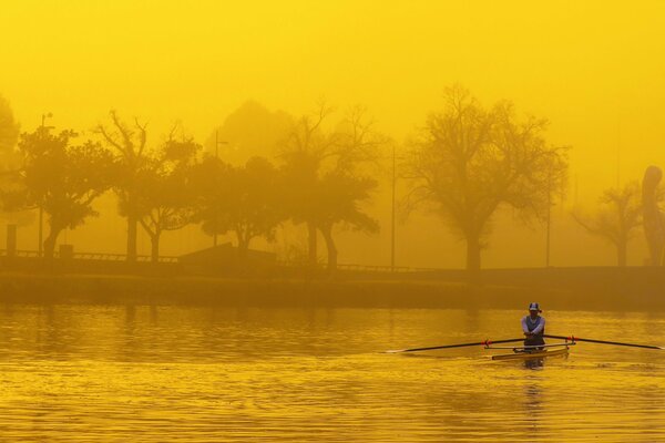 Autumn morning sports rowing on the river