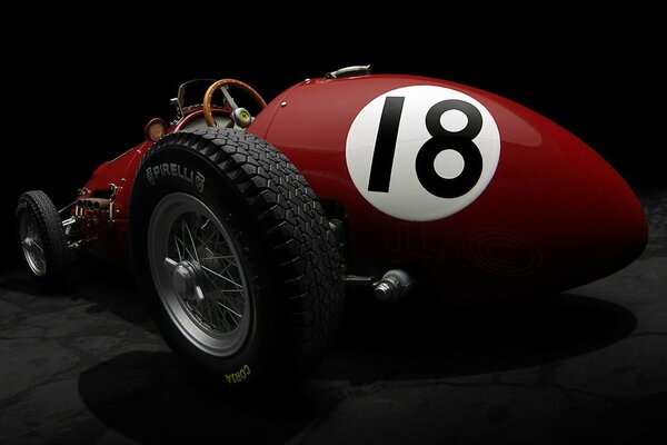 The car is a red Ferrari 500 f2 of 1952