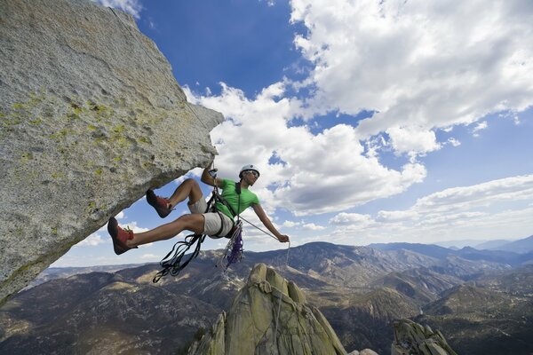 Rock climber on the background of an amazing mountain landscape