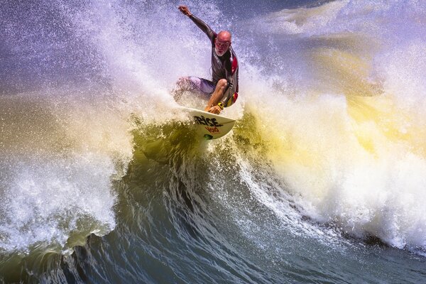 A man on a board on the waves