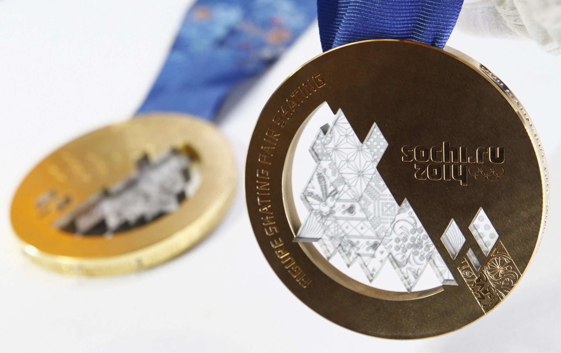 close up medal gold medal olympic games sochi-2014 gold bronze bronze medal