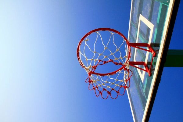 Basketball basket on the sky background