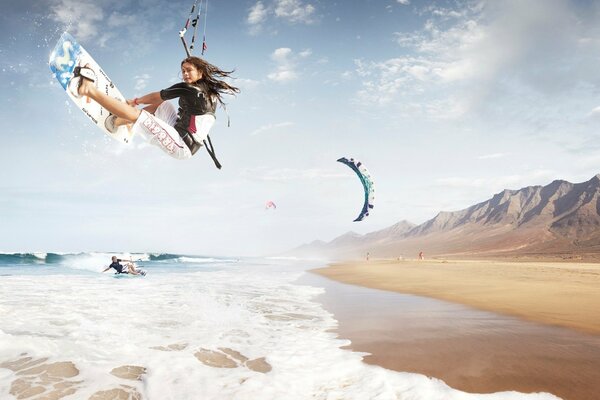 Activities on the beach near the mountains kitesurfing