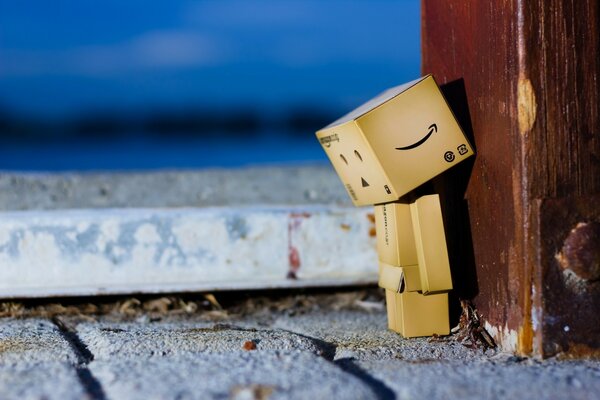 Sad little man made of cardboard