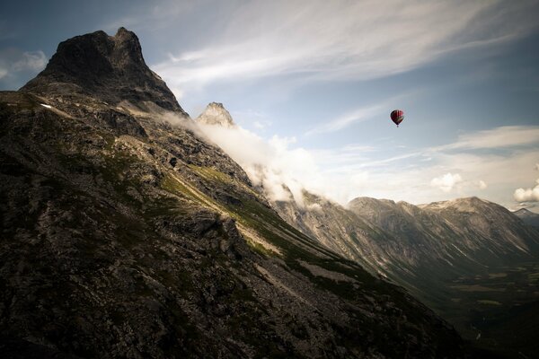 A ball on a blue sky background in the mountains