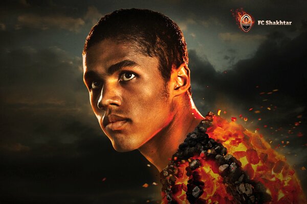 Image of football player Douglas costa surrounded by fire
