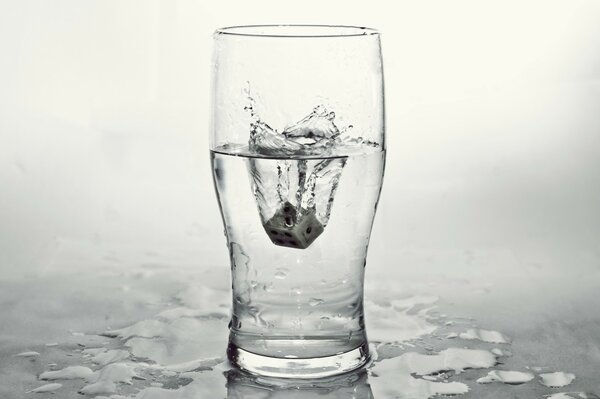 A dice in a glass of water