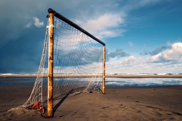 Football gates by the river against the sky