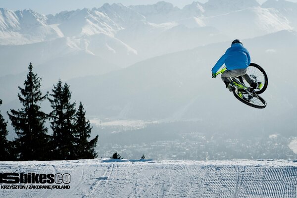 Jumping on a bike on a background of snow