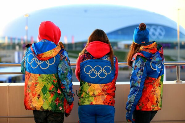 Volunteers with symbols at the Sochi 2014 Olympics