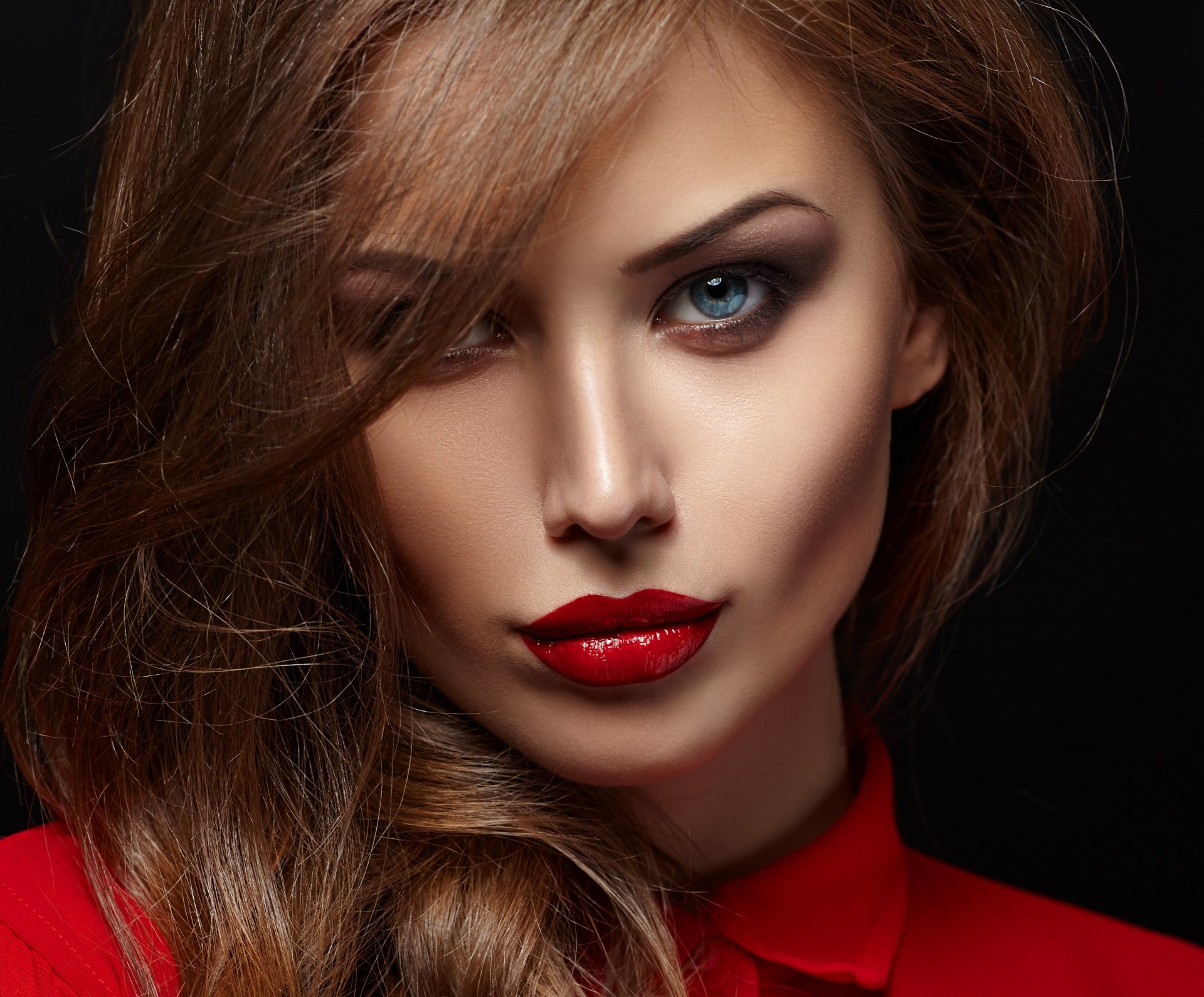 girl face make-up red lips view hair curls black background shirt