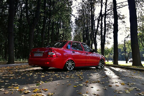 Red Lada Priora 2170 in nature