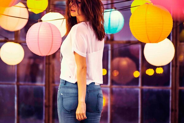 A girl with colored balls at a photo shoot