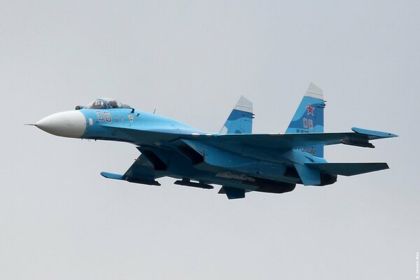 The Russian Su 27 looks like a bird of prey in the sky.