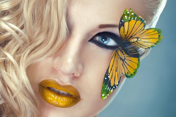 Yellow butterfly on eyelashes