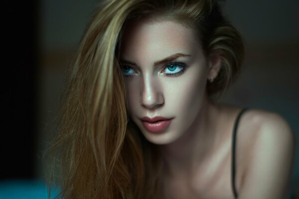 A blue-eyed girl with a piercing gaze