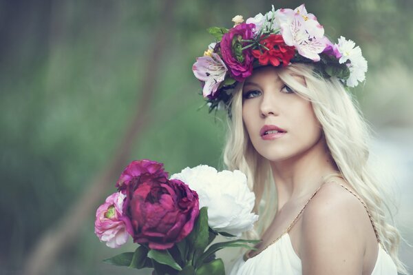 Blonde with a wreath of peonies on her head