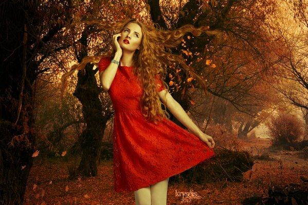 Ragazza in abito rosso con labbra rosse su sfondo autunno
