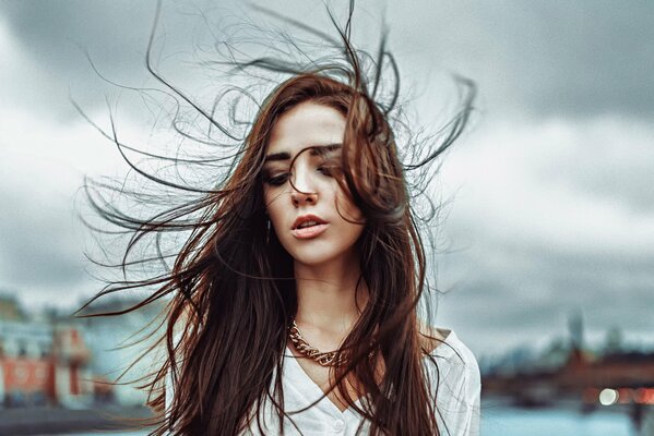 A girl blown up by the wind