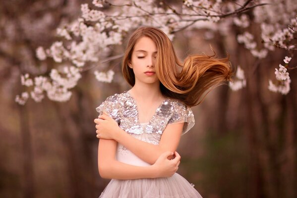 Spring girl and sakura branch