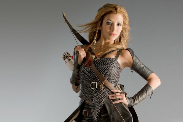 A girl in chain mail with a bow and arrows