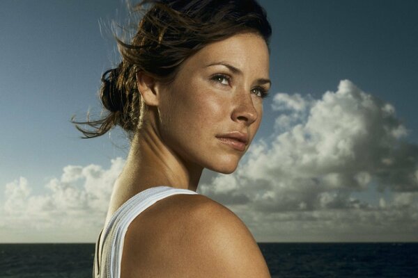 Portrait of a woman against the background of the sea and sky